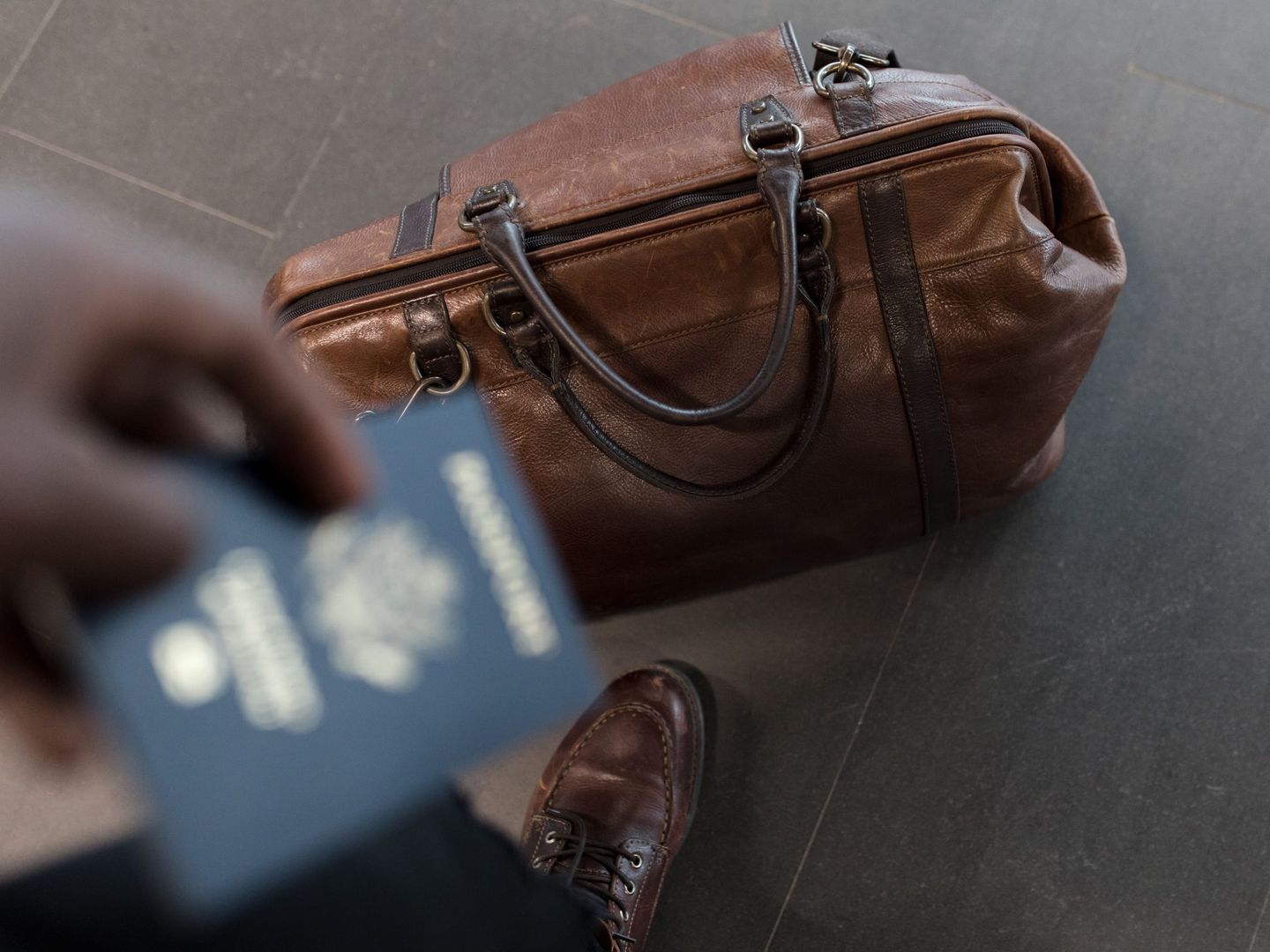 A founder with a passport at the airport